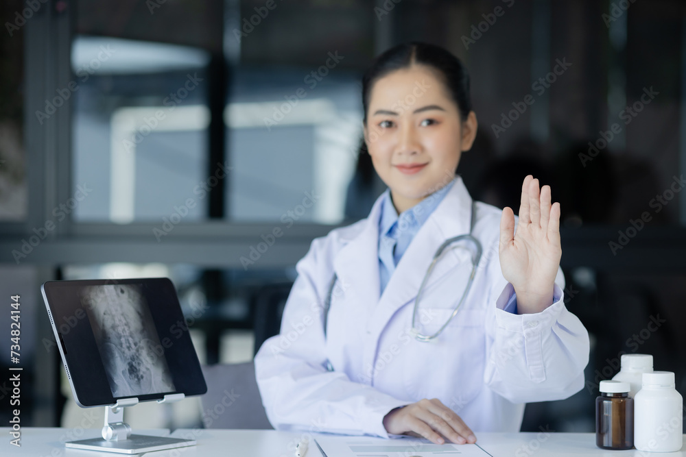 Asian female doctor working with laptop and health personal data in modern clinic, Healthcare and medical concept. Asian female doctor working with laptop and health personal data in modern clinic, Healthcare and medical concept.