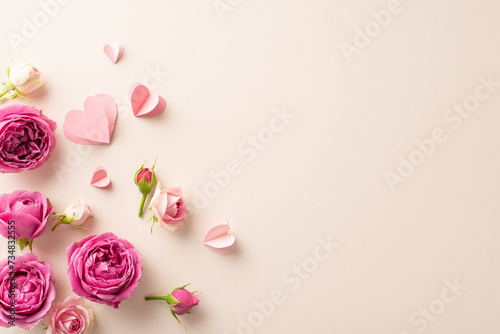 8th March wishes with an elegant top view display of slender paper hearts intertwined with fresh rose blooms on a gentle beige surface, providing a perfect spot for text or ads