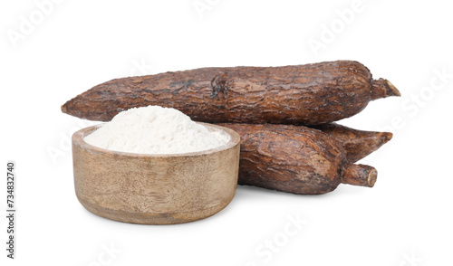 Bowl with cassava flour and roots isolated on white