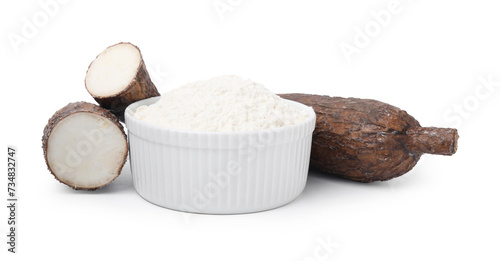 Bowl with cassava flour and roots isolated on white