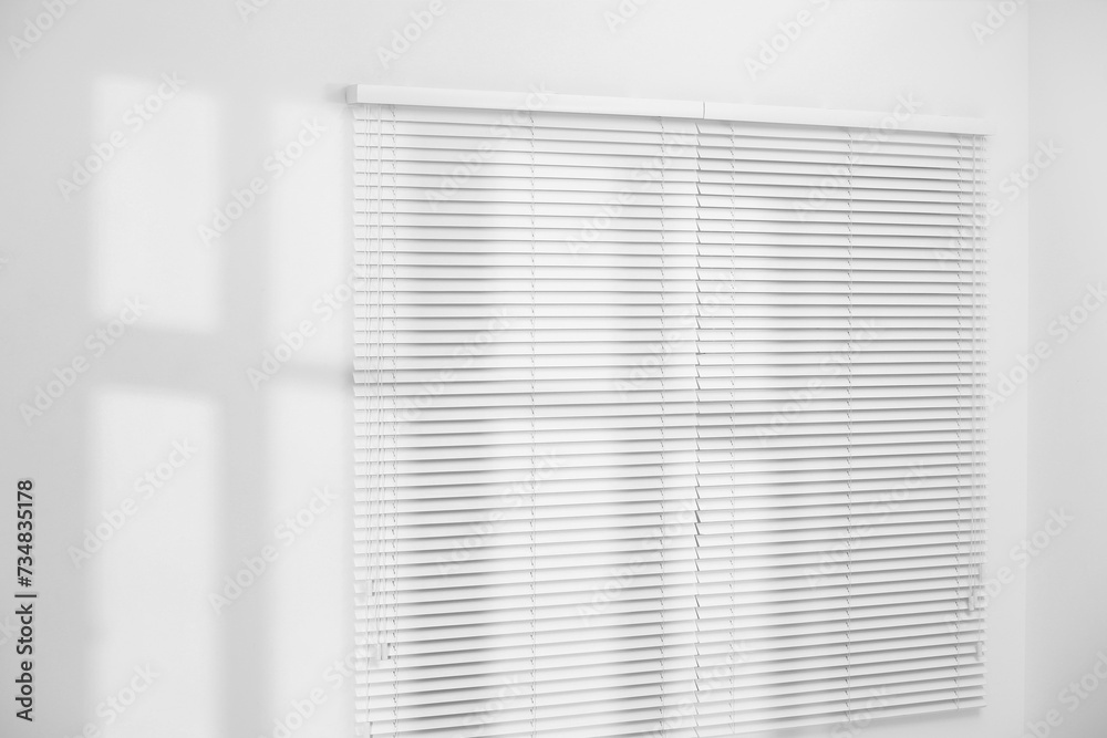 Light and shadows from window on wall indoors Light and shadows from window on wall indoors