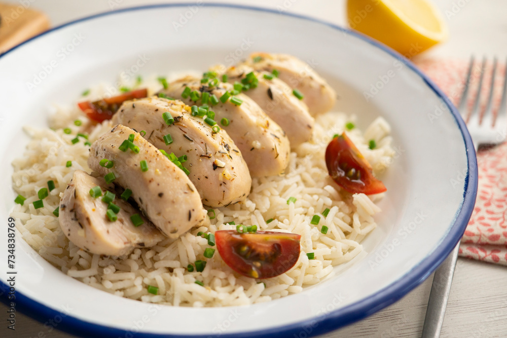 Chicken cooked with lemon and thyme over rice. Chicken cooked with lemon and thyme over rice.