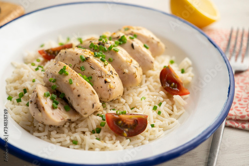 Chicken cooked with lemon and thyme over rice.