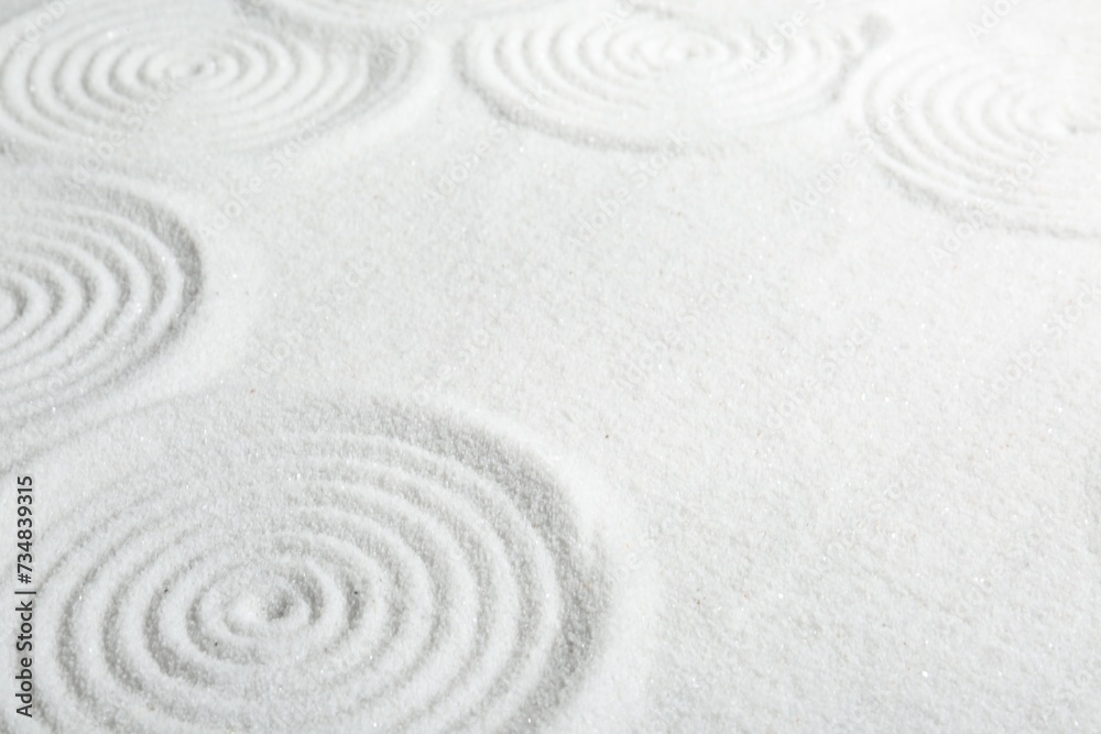 Zen rock garden. Circle patterns on white sand Zen rock garden. Circle patterns on white sand