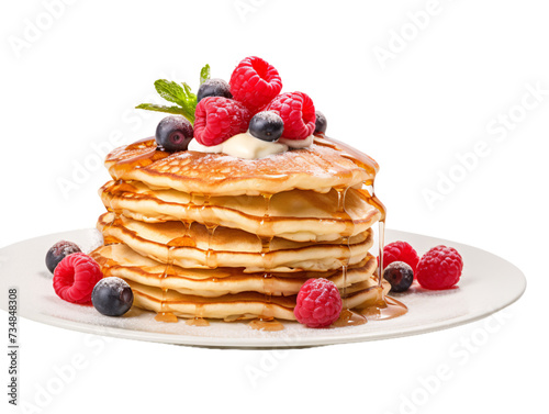 a stack of pancakes with berries on top