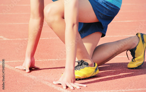Cropped image of a sprinter getting ready to start at the stadium