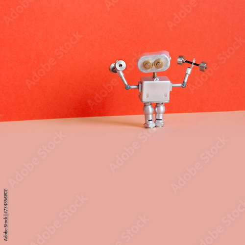 Robot athlete holds dumbbells. sports exercise fitness training. copy space