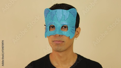 Latin young male disguised as PJ cartoon with a children's mask photo