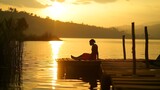 Peaceful lifestyle shot of woman sitting on dock at sunset on Lake Bunyonyi, Uganda, Africa. : Generative AI