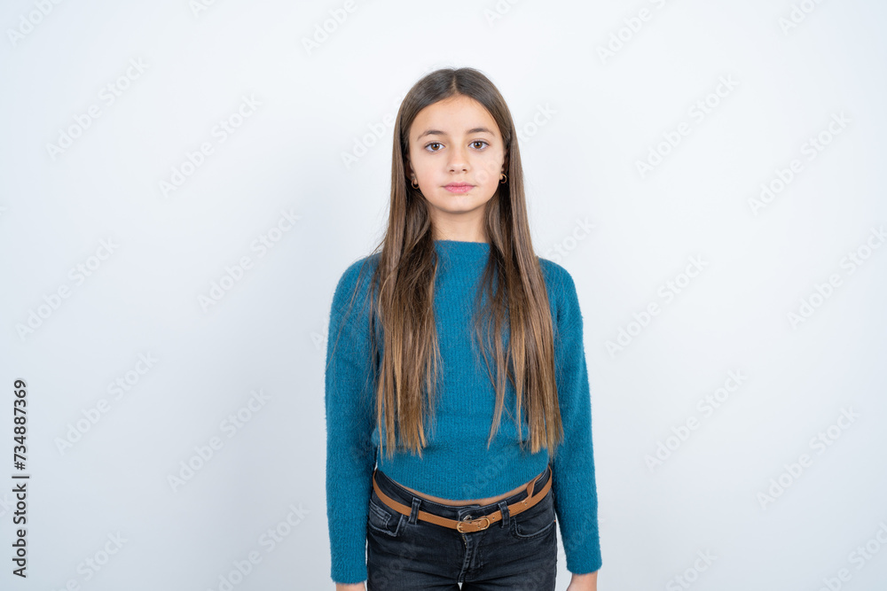 beautiful kid girl wearing blue sweater with a happy and cool smile on face. Lucky person. beautiful kid girl wearing blue sweater with a happy and cool smile on face. Lucky person.