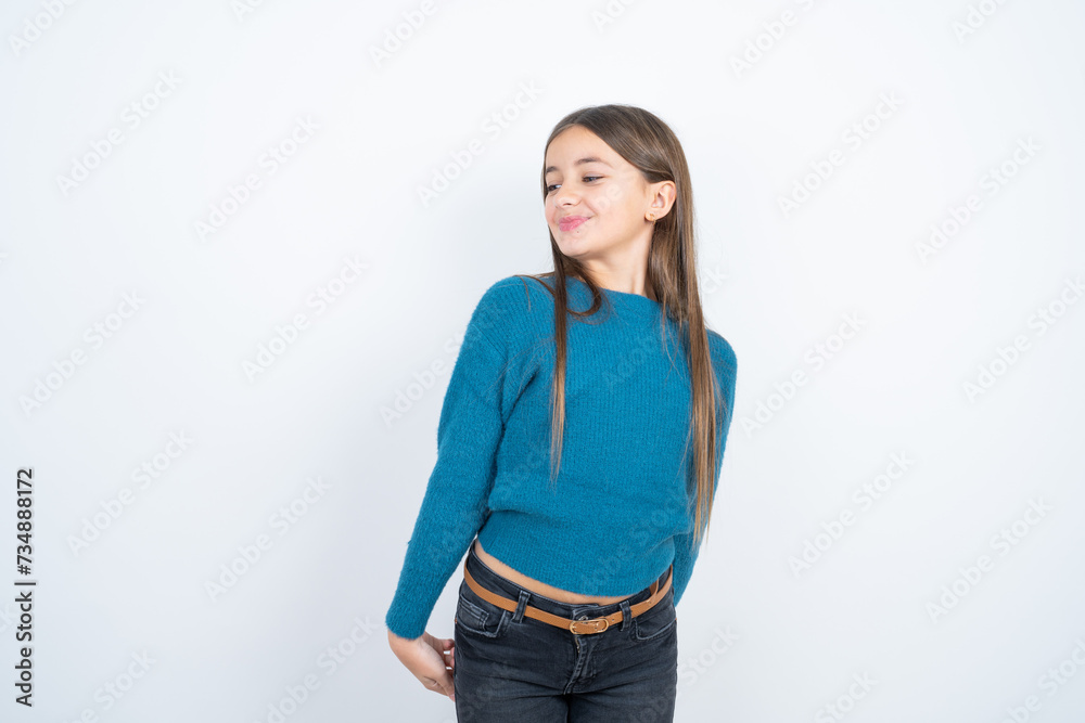 beautiful kid girl wearing blue sweater very happy and excited about new plans. beautiful kid girl wearing blue sweater very happy and excited about new plans.