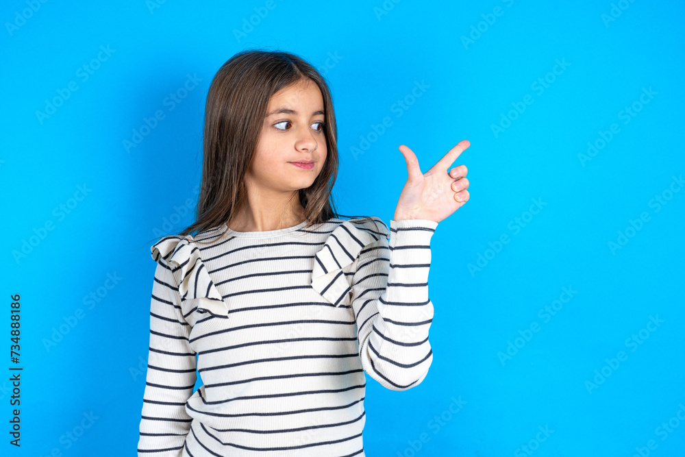 beautiful kid girl wearing plaid shirt pointing up with fingers number eight in Chinese sign language BÄ. beautiful kid girl wearing plaid shirt pointing up with fingers number eight in Chinese sign language BÄ.