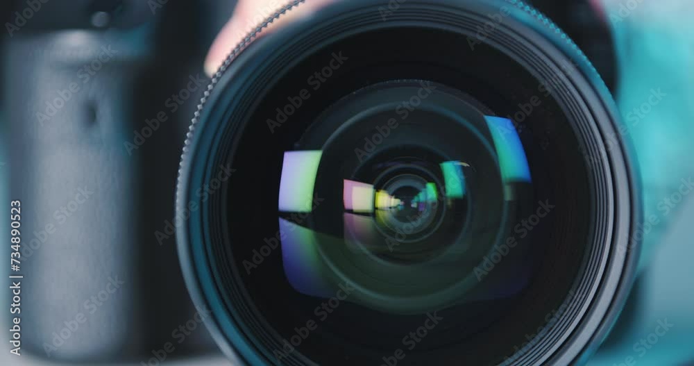 Close-up of wide-angle camera lens with color reflections focus adjustment, concept hobby, professional photography