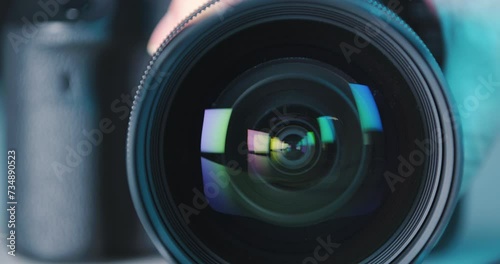 Close-up of wide-angle camera lens with color reflections focus adjustment, concept hobby, professional photography