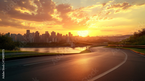 Race track road and bridge with city skyline at sunset. © Santy Hong