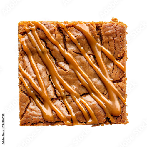  top view of a butterscotch blondie with a caramel drizzle, placed on the white floor in food photography style isolated on a white background photo