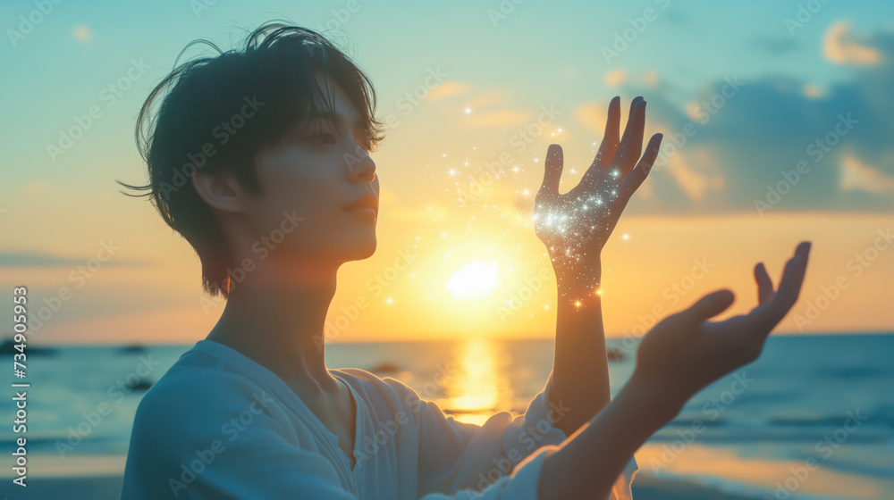 Man Capturing Sparkling Sunlight in Hand at Sunset