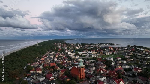 Aerial drone view of  Baltic Sea coast in Hel peninsula, Jastarnia. Puck Bay in Poland. Jastarnia city in Poland.  Cloudy sunset in Jastarnia. photo