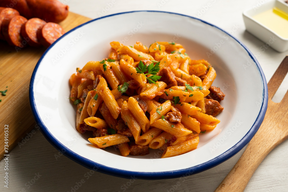 Macaroni dish with tomato sauce and Spanish chorizo. Macaroni dish with tomato sauce and Spanish chorizo.