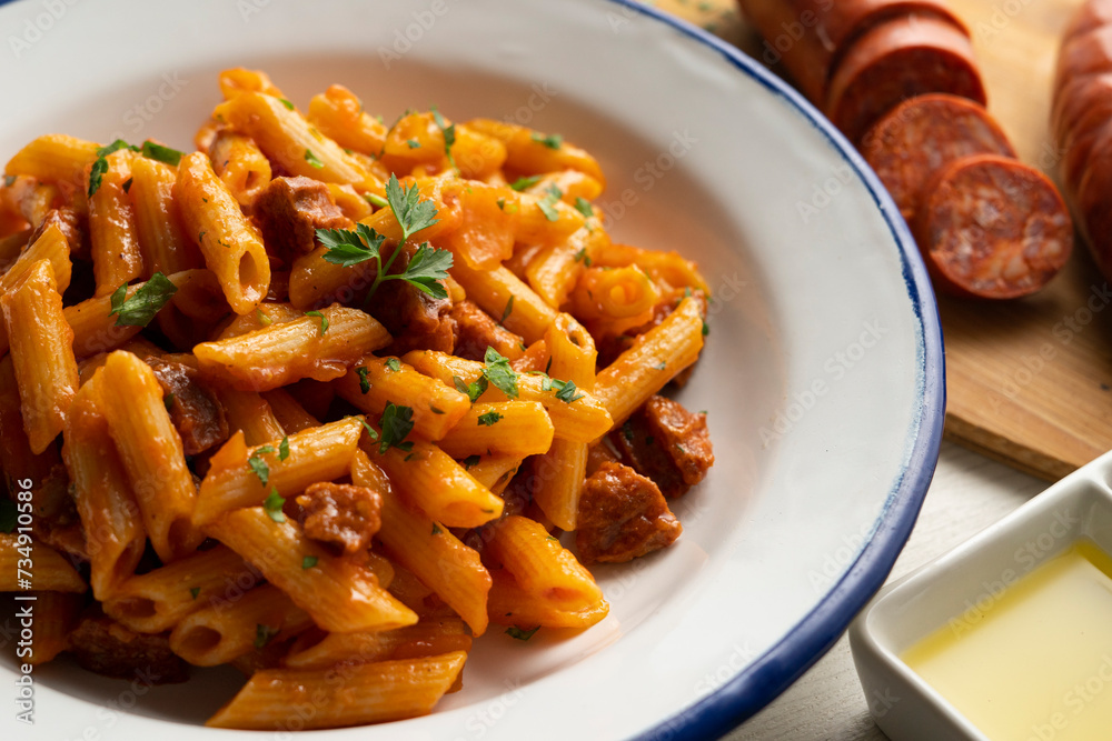 Macaroni dish with tomato sauce and Spanish chorizo. Macaroni dish with tomato sauce and Spanish chorizo.