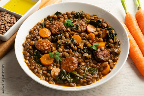 Lentil stew with chorizo and carrot. Traditional Spanish recipe.