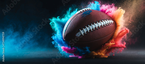 Obraz na płótnie Banner. Dynamic shot of American Football ball flying from colorful dust in motion against black background with negative space to insert text w salonie