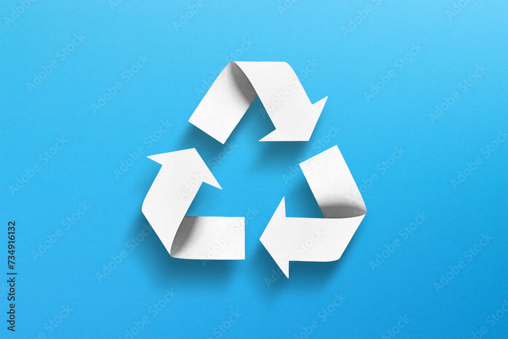 Recycle symbol made of paper on blue background Recycle symbol made of paper on blue background
