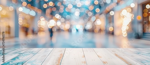 Empty wooden table poised as perfect stage for showcasing products background is blur of bustling commercial area within shopping mall lending sense of depth and context to scene