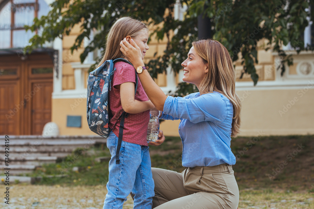 Mother and daughter preparing the first day going study back to school student concept at village street with schoolbag family lifestyle. Getting ready for school Mother and daughter preparing the first day going study back to school student concept at village street with schoolbag family lifestyle. Getting ready for school