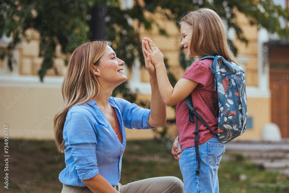 Mother and daughter preparing the first day going study back to school student concept at village street with schoolbag family lifestyle. Getting ready for school Mother and daughter preparing the first day going study back to school student concept at village street with schoolbag family lifestyle. Getting ready for school