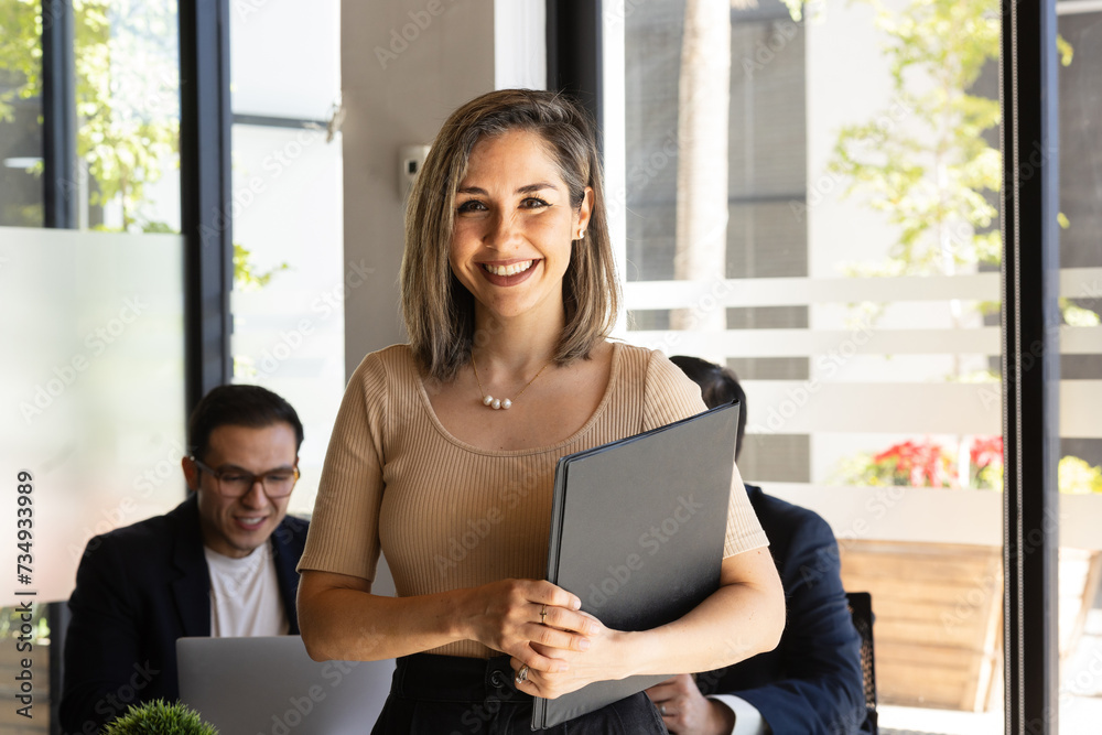 Portrait of a beautiful businesswoman smiling and getting ready for a business meeting Portrait of a beautiful businesswoman smiling and getting ready for a business meeting