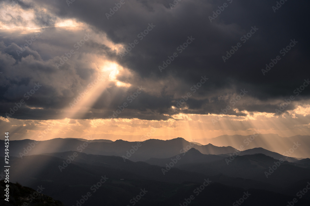 Beautiful dramatic cloudscape in a stormy day in the Basque Country. Dark sunset landscape with copy space