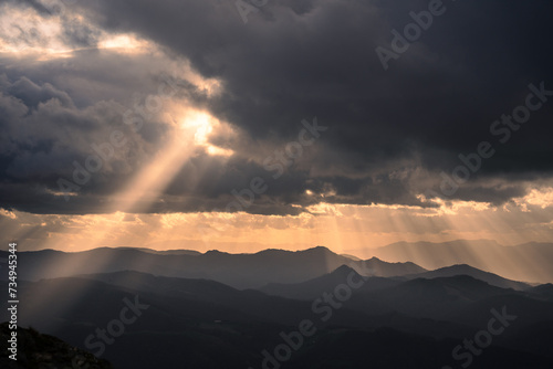 Beautiful dramatic cloudscape in a stormy day in the Basque Country. Dark sunset landscape with copy space