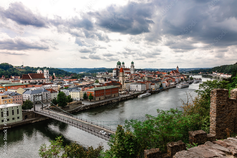Panoramic view of Passau. Top view of suspension bridge. Aerial skyline of old town with beautiful reflection in Danube river, Bavaria, Germany. High quality photo Panoramic view of Passau. Top view of suspension bridge. Aerial skyline of old town with beautiful reflection in Danube river, Bavaria, Germany. High quality photo