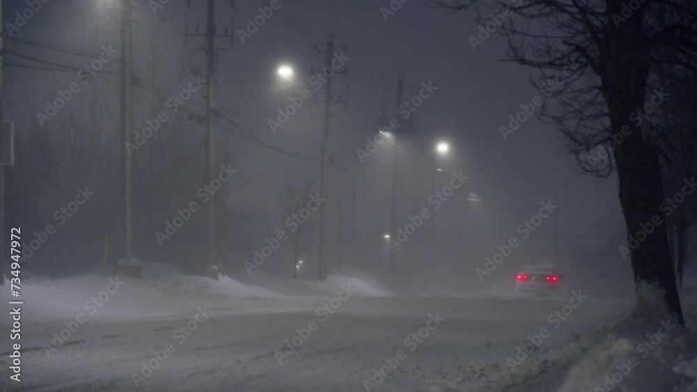Scenic view snow covered city highway slippery road drive cars moving night motion. Snowfall danger blizzard bad winter weather conditions. Urban cold snowy day snowstrom town Dartmouth, Canada. Scenic view snow covered city highway slippery road drive cars moving night motion. Snowfall danger blizzard bad winter weather conditions. Urban cold snowy day snowstrom town Dartmouth, Canada.