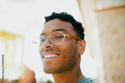 Portrait of smiling man wearing eyeglasses photo