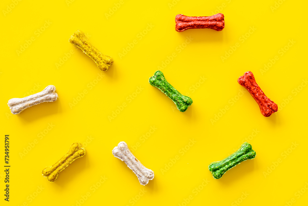 Dog food and treats - chew bones pattern, top view Dog food and treats - chew bones pattern, top view