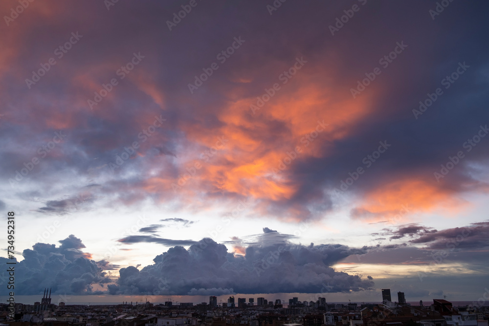 View of cloudy sky at sunrise in the city of Barcelona (Spain)