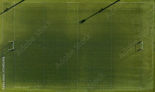Perpendicular aerial view of an artificial turf rugby field. The sports facility is empty.
 photo
