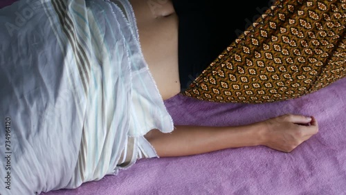 Therapeutic Bliss: Woman Wrapped in Linens Receives Bodywork
