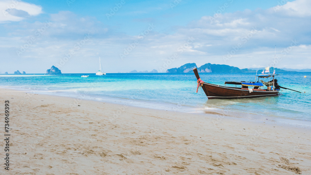 Longtail boat on the tropical beach of Koh Kradan Trang Thailand