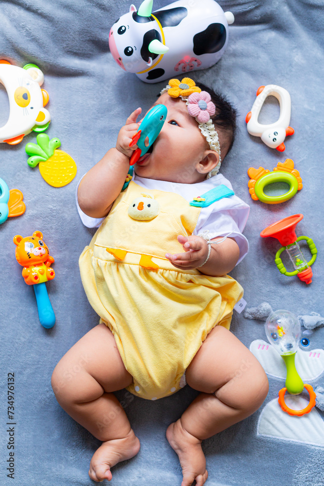 Baby in cute outfit with toys,Little girl 3-6 months old in cute outfits