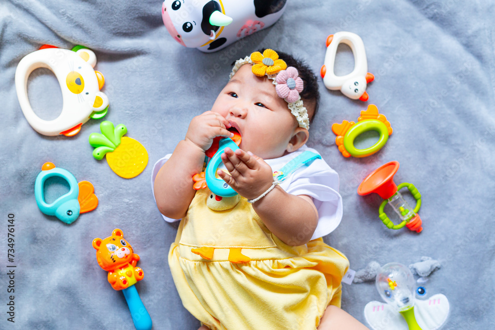 Fototapeta premium Baby in cute outfit with toys,Little girl 3-6 months old in cute outfits