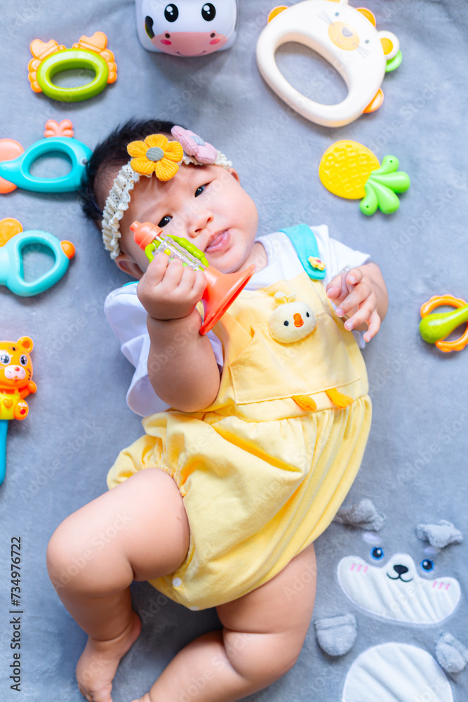 Baby in cute outfit with toys,Little girl 3-6 months old in cute outfits