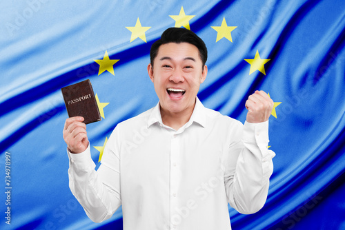 Immigration. Happy man with passport against flag of European Union photo