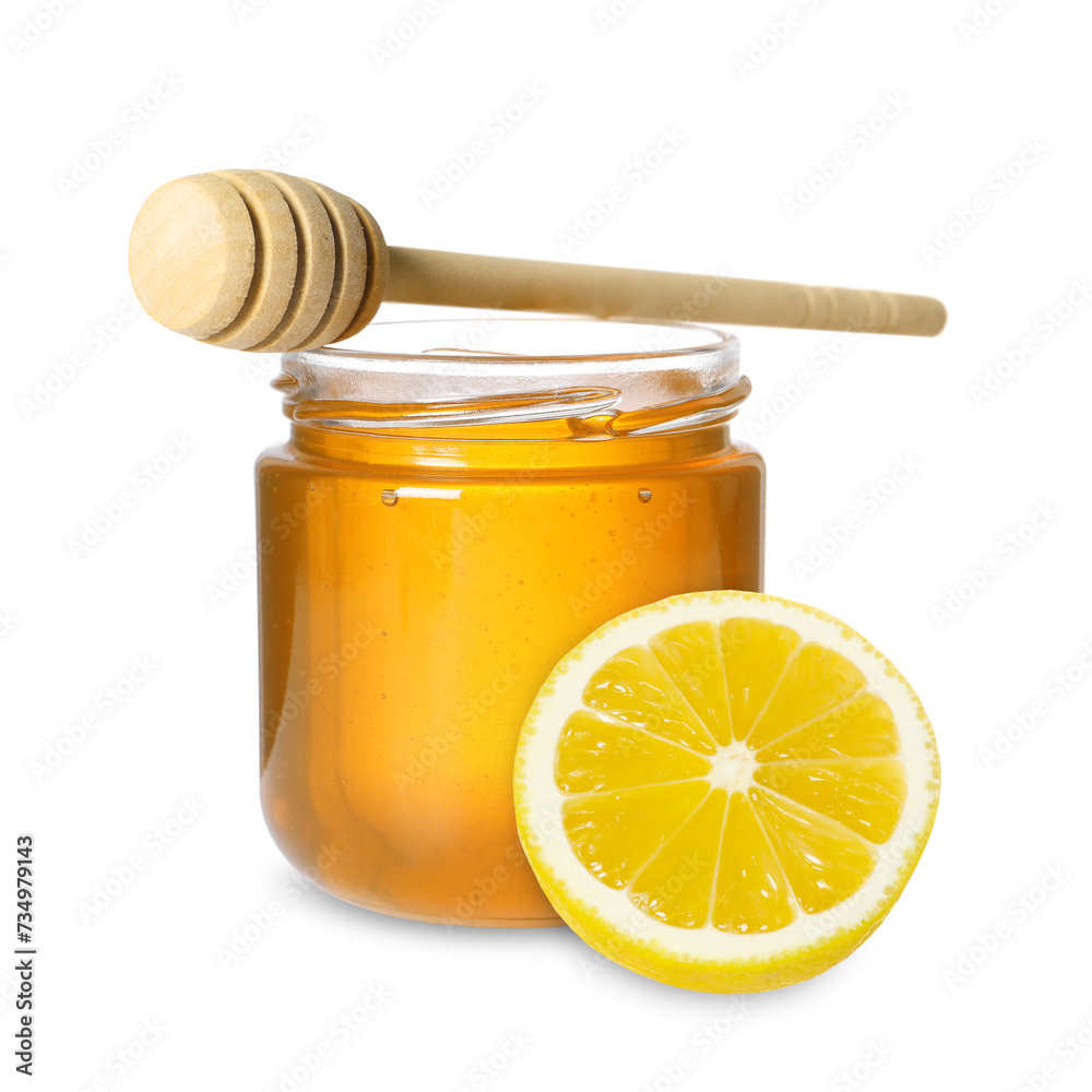 Honey in glass jar, dipper and lemon isolated on white Honey in glass jar, dipper and lemon isolated on white