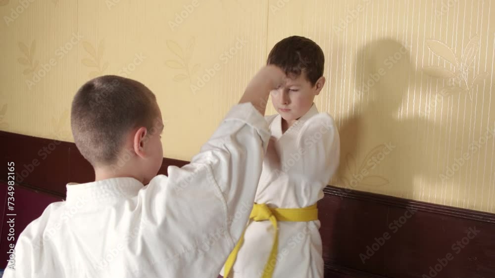 Boys training exercise block against punch Boys training exercise block against punch