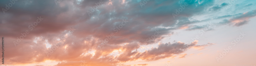 Beautiful dramatic sky at sunset.Pink and blue clouds.Banner.