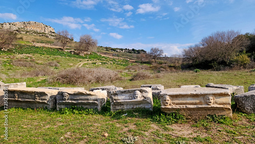 The facial reliefs carved on marble rock to show the type of plays such as comedy, tragedy, etc. in the amphitheater of the  Castabala, which was an antique city dates back 2500 years. It is locate photo