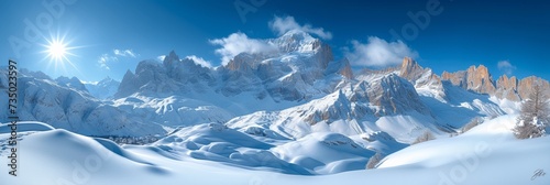 A serene winter landscape: snow-capped mountains under a clear blue sky, offering pristine views and outdoor adventures.